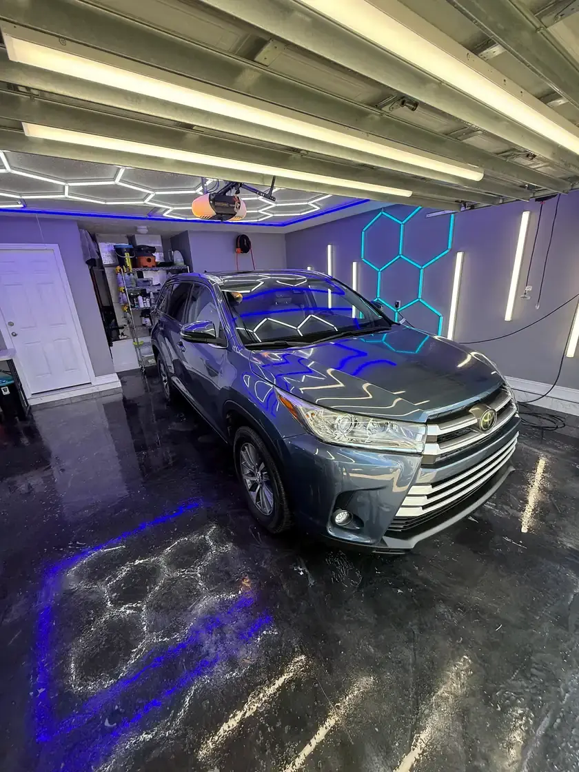 Grey 2017 Toyota Highlander after a full interior and exterior detail under the hex lights at Ceramico in Panama City FL