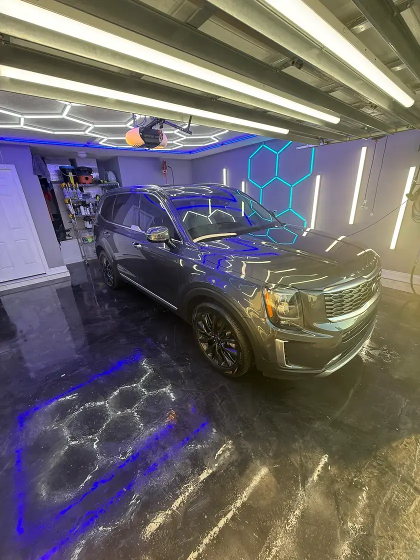 Grey 2021 Kia Telluride after a full interior and exterior detail under the hex lights at Ceramico in Panama City FL