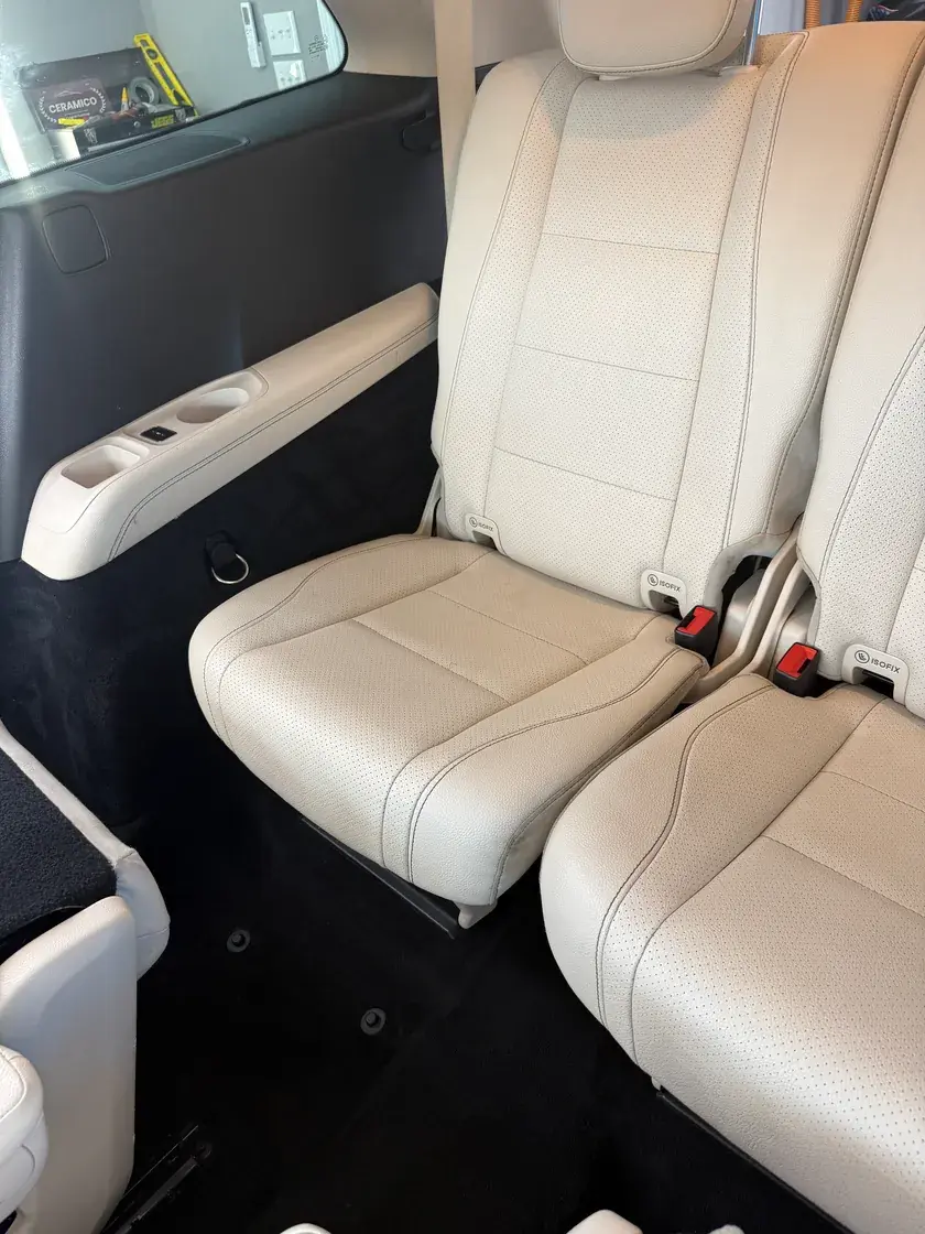 Clean cream leather rear seats in a 2021 Mercedes GLS450 after a full detail at Ceramico in Panama City FL
