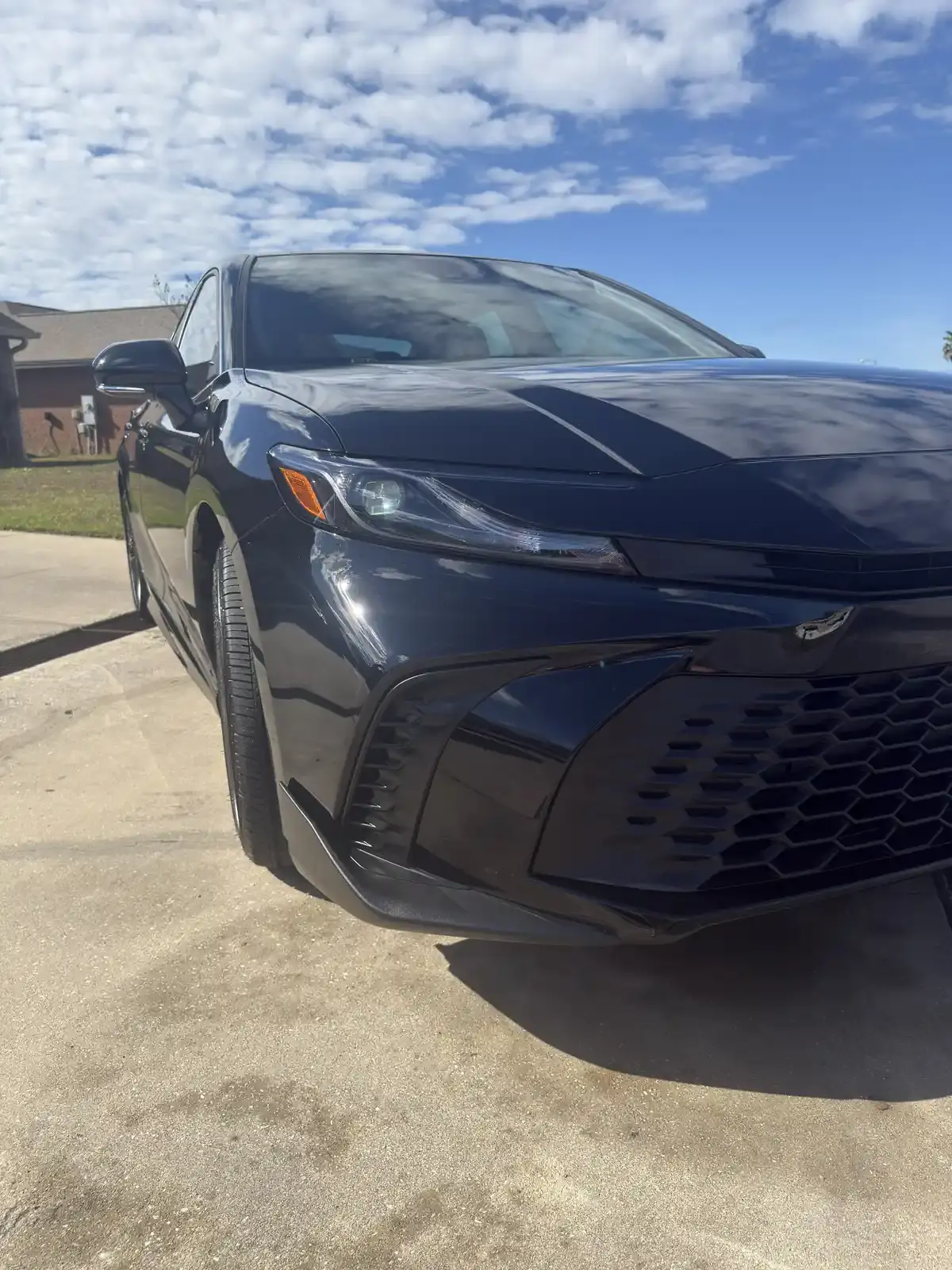 Front view of a dark blue 2026 Toyota Camry with a fresh ceramic coating in Panama City FL