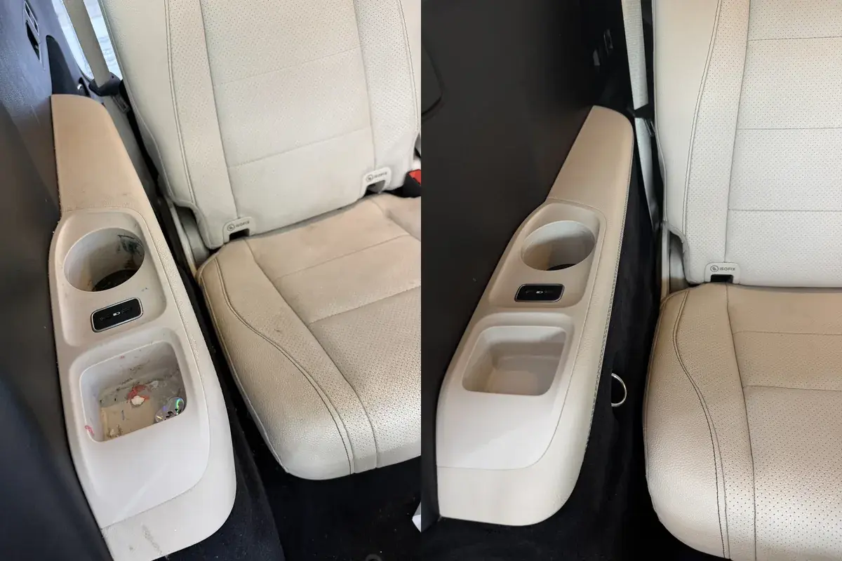Before and after of the rear cup holder trim panel in a 2021 Mercedes GLS450 after interior detailing in Panama City FL