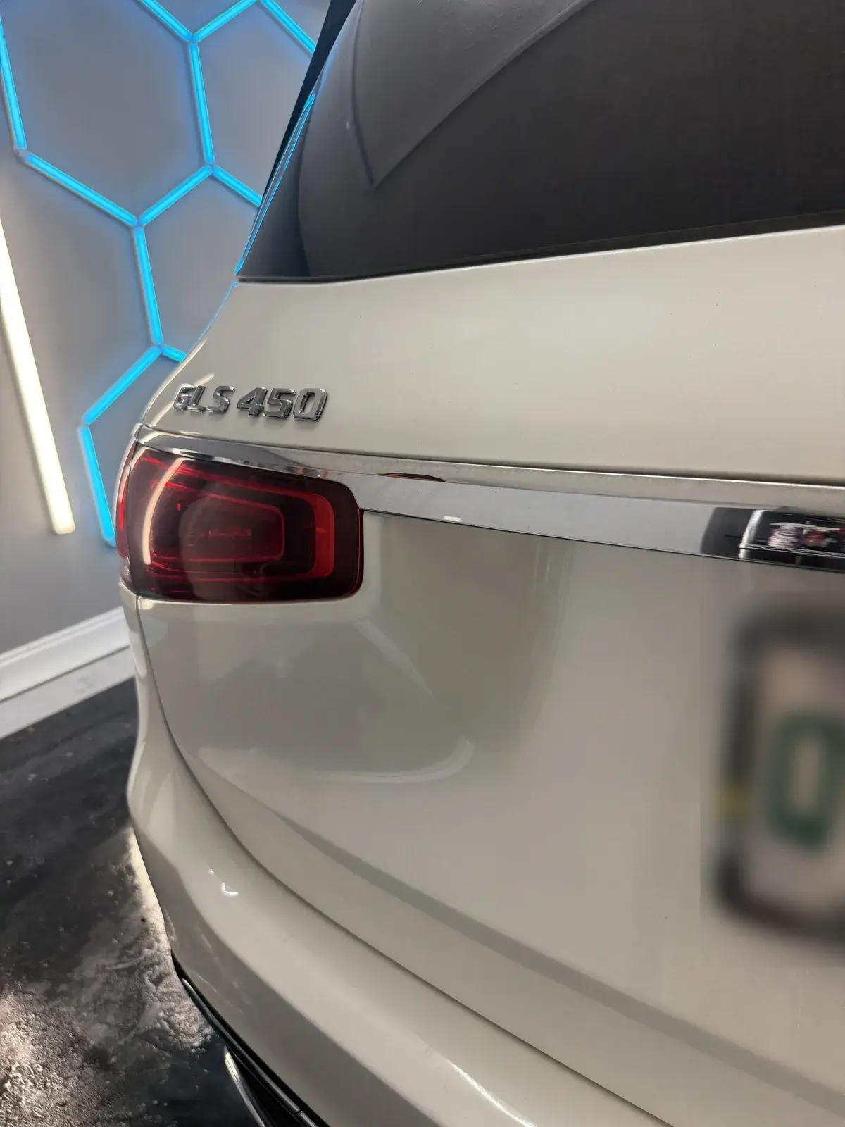 White 2021 Mercedes GLS450 under the hex shop lights after a full detail in Panama City FL
