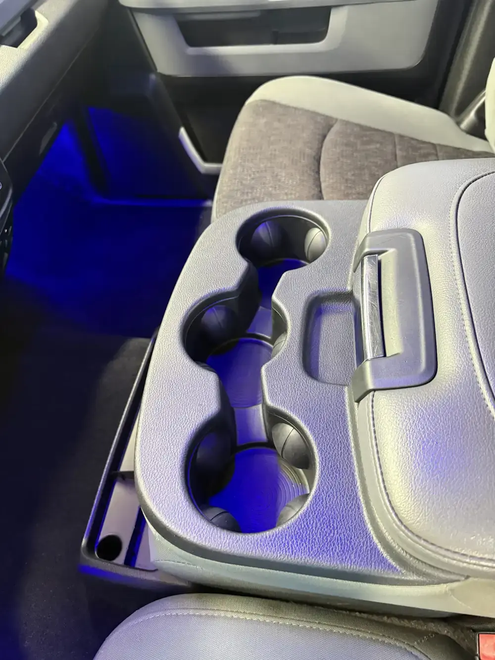 Clean center console and cup holders in a 2019 Ram 1500 after an interior detail in Panama City FL