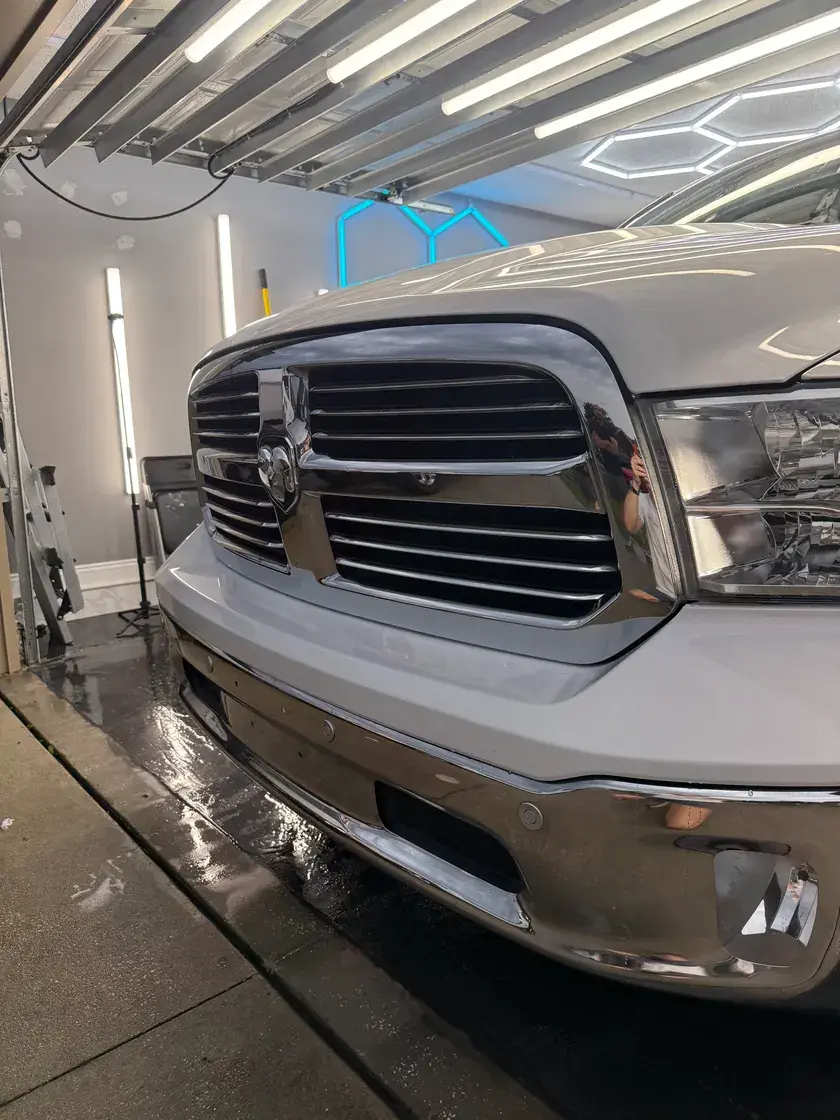 White 2019 Dodge Ram 1500 front end after a full interior and exterior detail at Ceramico in Panama City FL