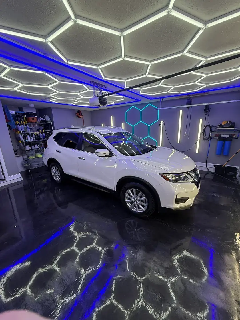 White 2020 Nissan Rogue after a full interior and exterior detail under the hex lights at Ceramico in Panama City FL
