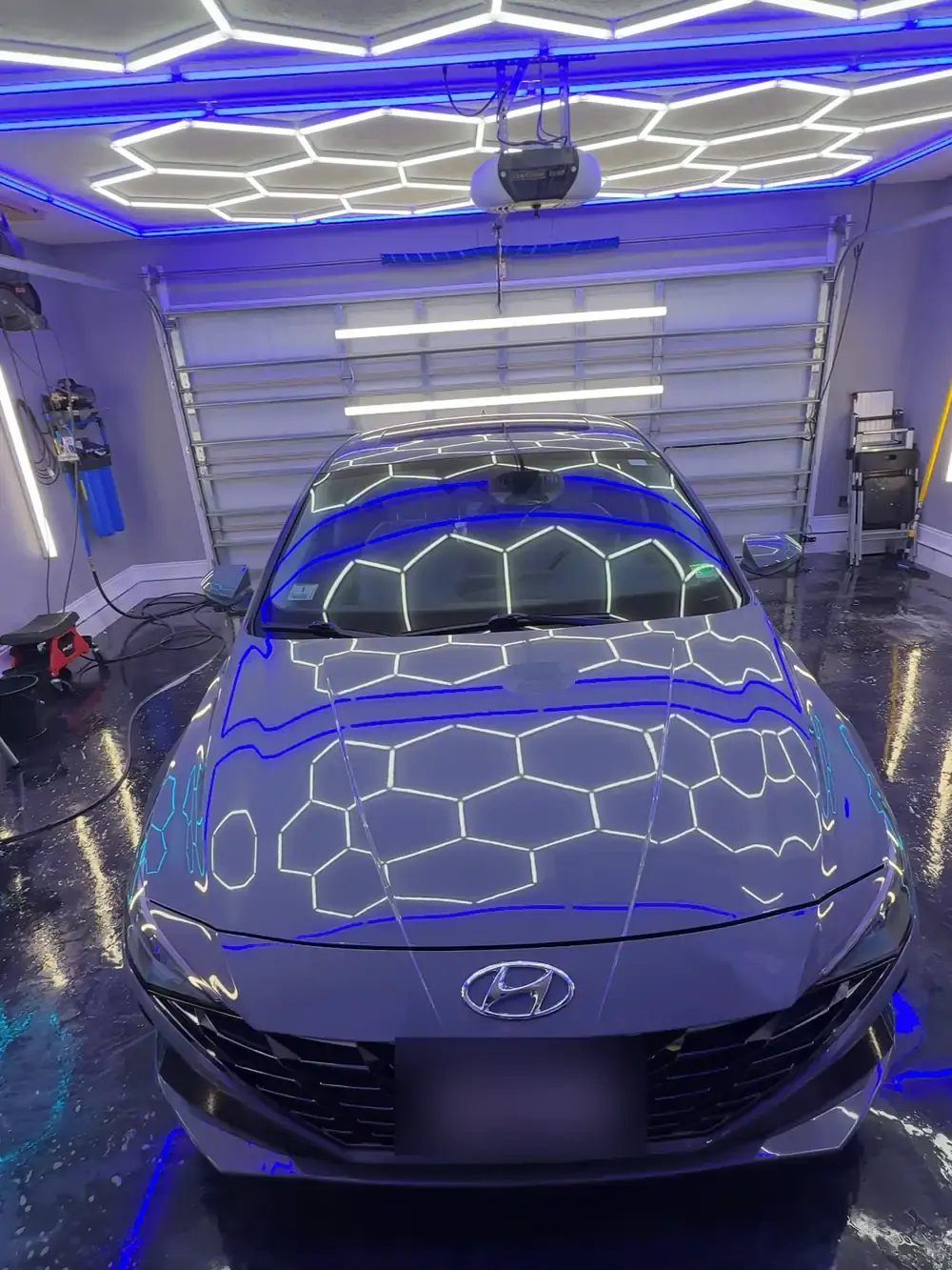 Grey 2023 Hyundai Elantra after a full interior and exterior detail under the hex shop lights in Panama City FL